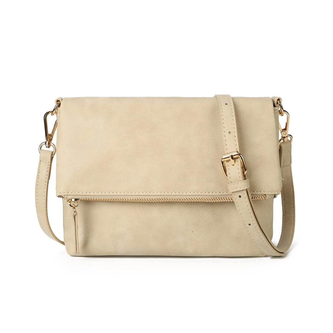 Accessoire mode femme: pochette bandoulière en similicuir texturé, pour un style raffiné.