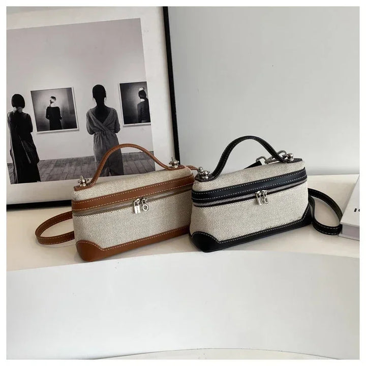 Accessoire de mode femme: pochette bandoulière grise, un must-have élégant et fonctionnel.