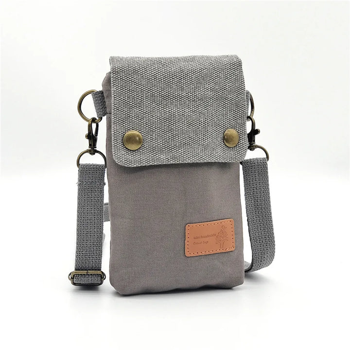Sacoche bandoulière Linoé femme, pochette smartphone compacte. Accessoire en tissu, organisateur pratique pour mobile.