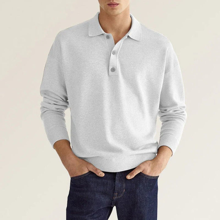 Polo homme manches longues, coupe élégante et confortable.  Tissu doux, idéal pour un style décontracté.