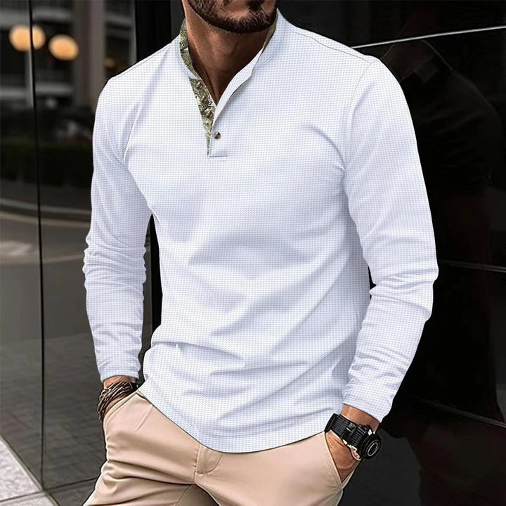 Polo homme manches longues, élégant et confortable.  Coupe impeccable, tissu doux.