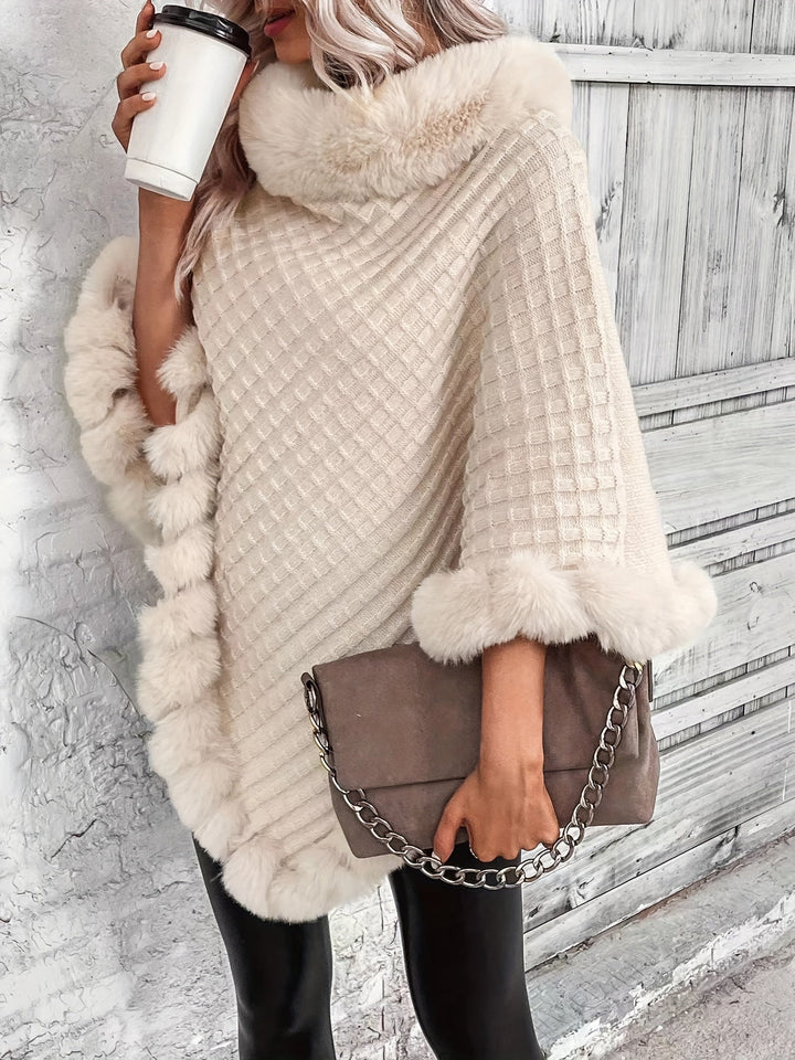 Poncho tricoté femme élégant avec bordure en fausse fourrure, parfait pour l'hiver et le style décontracté.