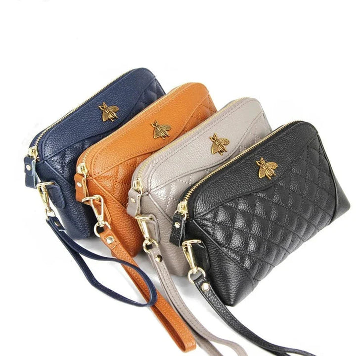 Portefeuille compagnon femme en cuir noir ouvert, révélant un compartiment zippé pour la monnaie