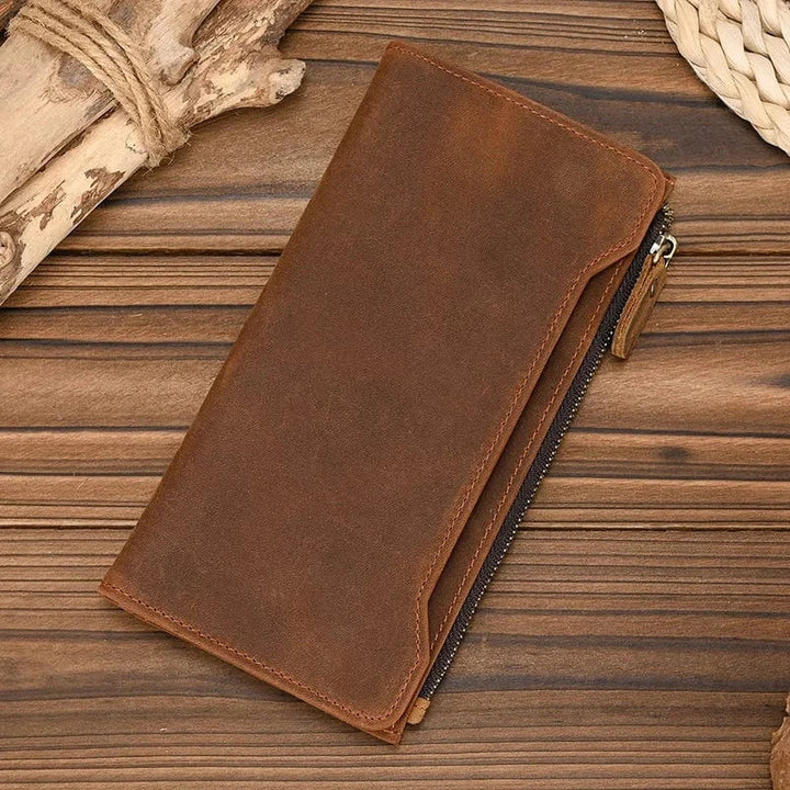 Portefeuille homme en cuir véritable marron foncé, zippé, style classique, pour un accessoire masculin élégant.