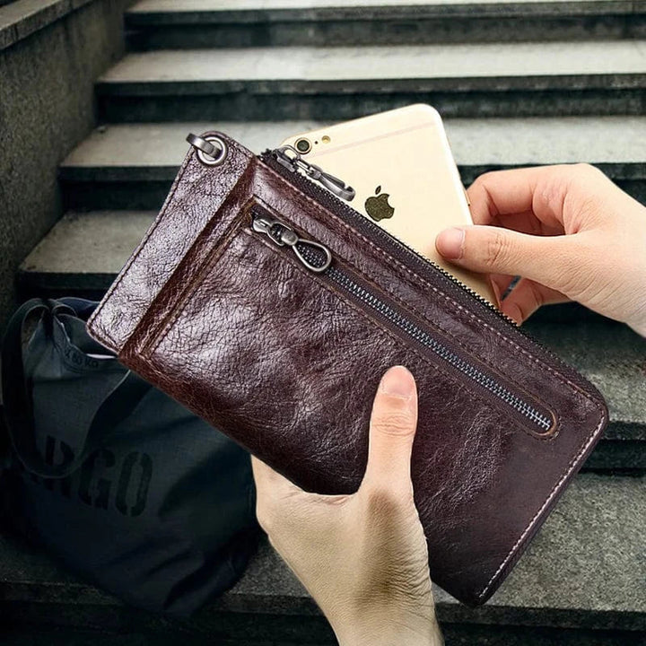 Accessoire élégant : portefeuille homme en cuir véritable long, couleur café, avec fermoir discret.