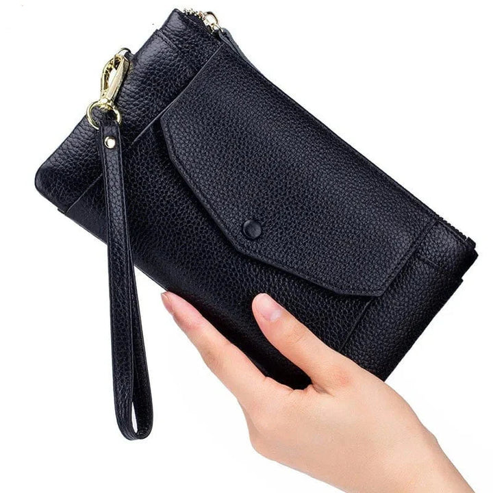 Portefeuille en cuir pour femme, format long, plusieurs compartiments, couleur marron foncé.