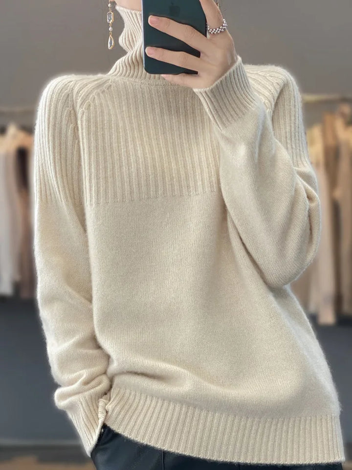 Pull femme hivernal col roulé, oversize et doux, offrant un confort absolu et un style moderne.