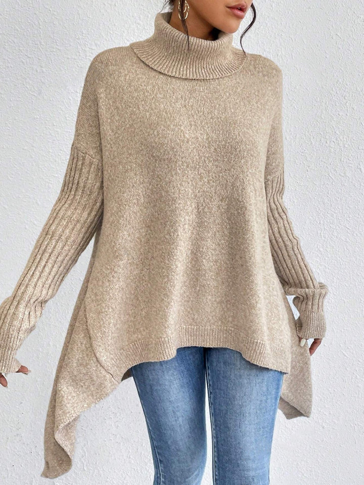 Pull col roulé femme, confort optimal, style moderne avec coupe ample et irrégulière, très élégant.