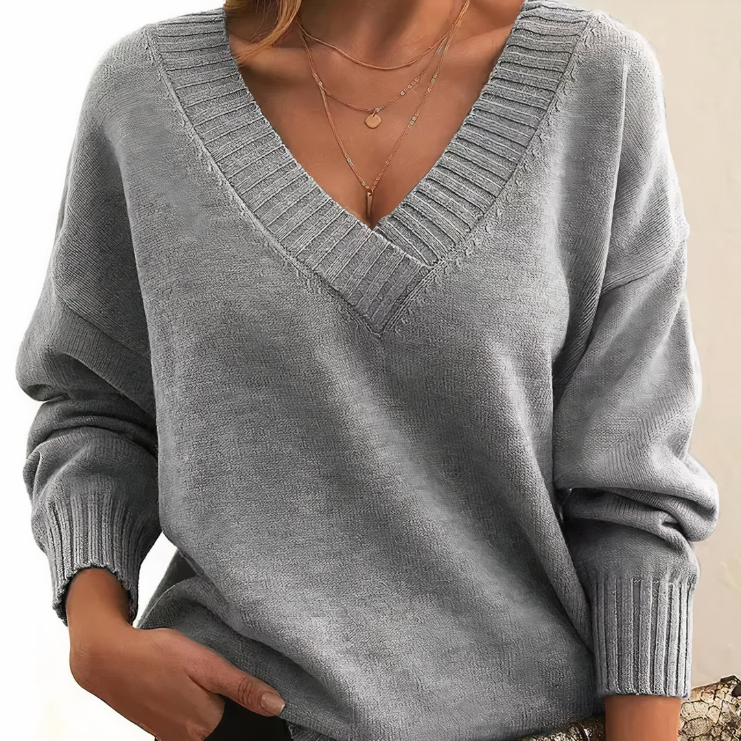 Pull femme chic à col V, doux au toucher et chaud, parfait pour l'élégance quotidienne.