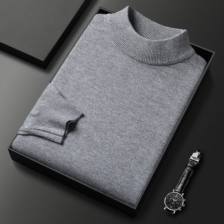 Photo d'un pull d'hiver homme élégant, col montant demi-zippé en tricot, offrant chaleur.