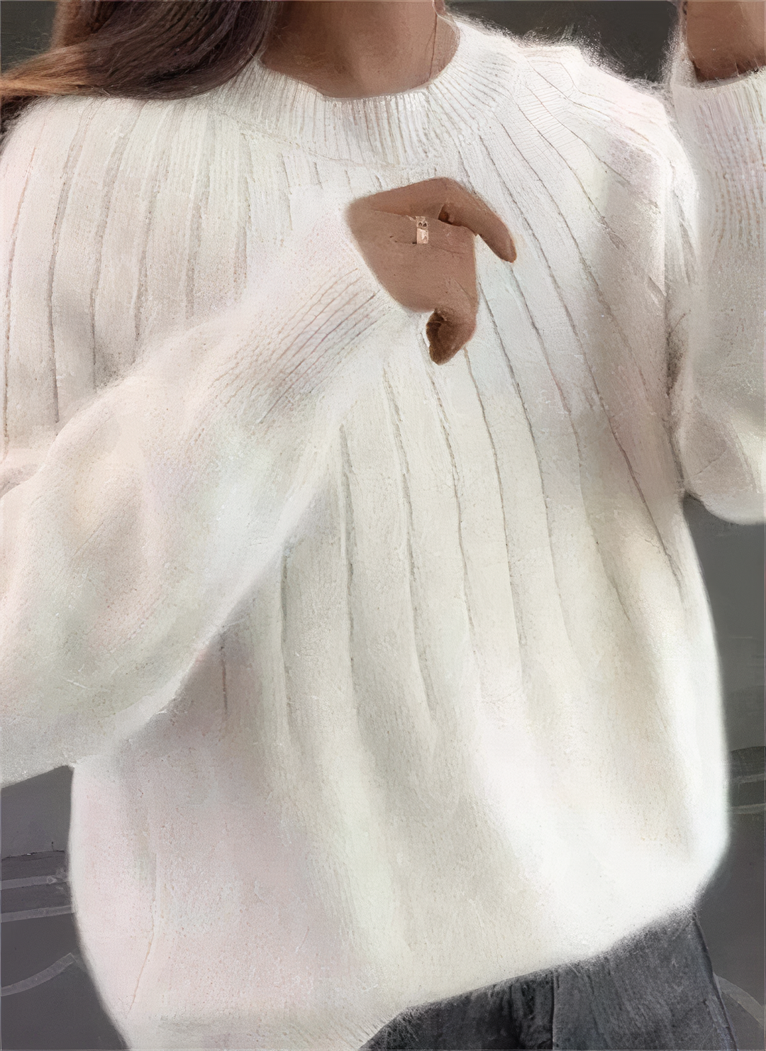Pull femme élégant à col rond, idéal pour un look chic et décontracté en mode hiver.