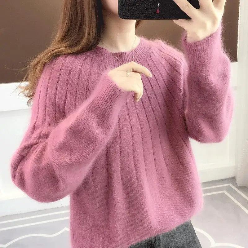 Haut femme douillet à col rond, en maille confortable pour un style hivernal polyvalent.