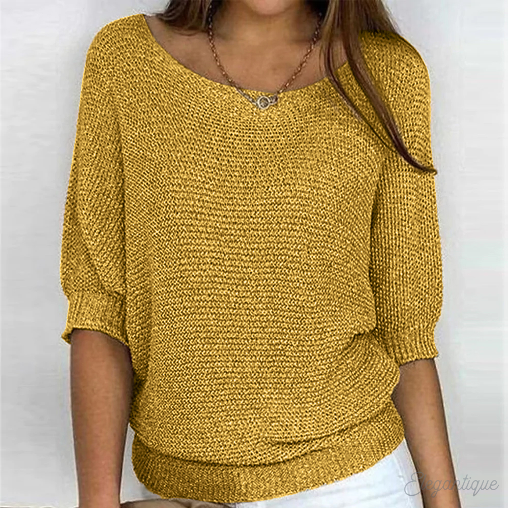 Pull femme élégant à col rond, parfait pour une tenue automne-hiver sophistiquée et confortable.