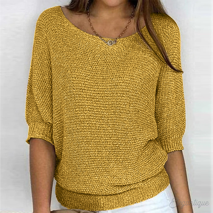 Pull femme élégant à col rond, parfait pour une tenue automne-hiver sophistiquée et confortable.