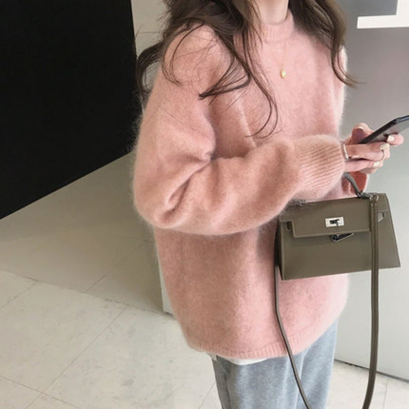 Pull élégant femme oversize, col rond, chaud et doux, pour un look hivernal tendance.