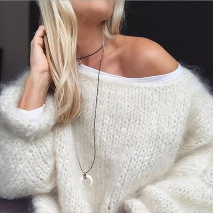 Pull femme tricoté en laine, style moderne et élégant.  Chaleur et confort assurés.