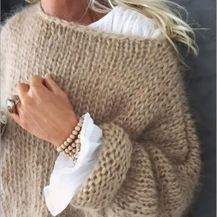 Pull femme tricoté en laine, style moderne et élégant.  Chaleur et confort assurés.