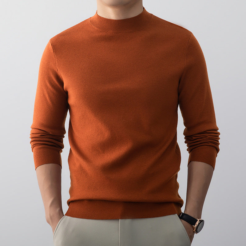 Pull homme plié, vêtement confortable et polyvalent, couleur sobre, prêt à porter.