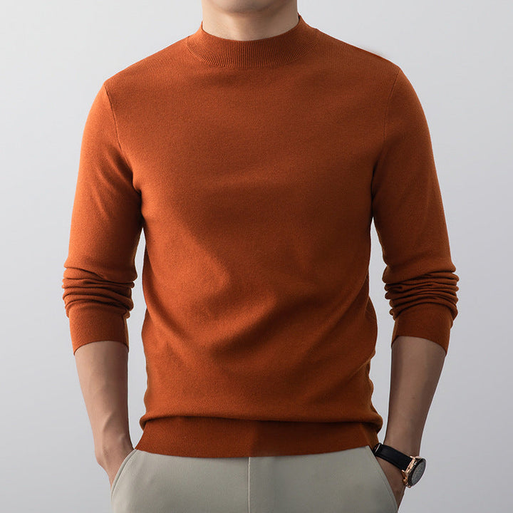 Pull homme plié, vêtement confortable et polyvalent, couleur sobre, prêt à porter.