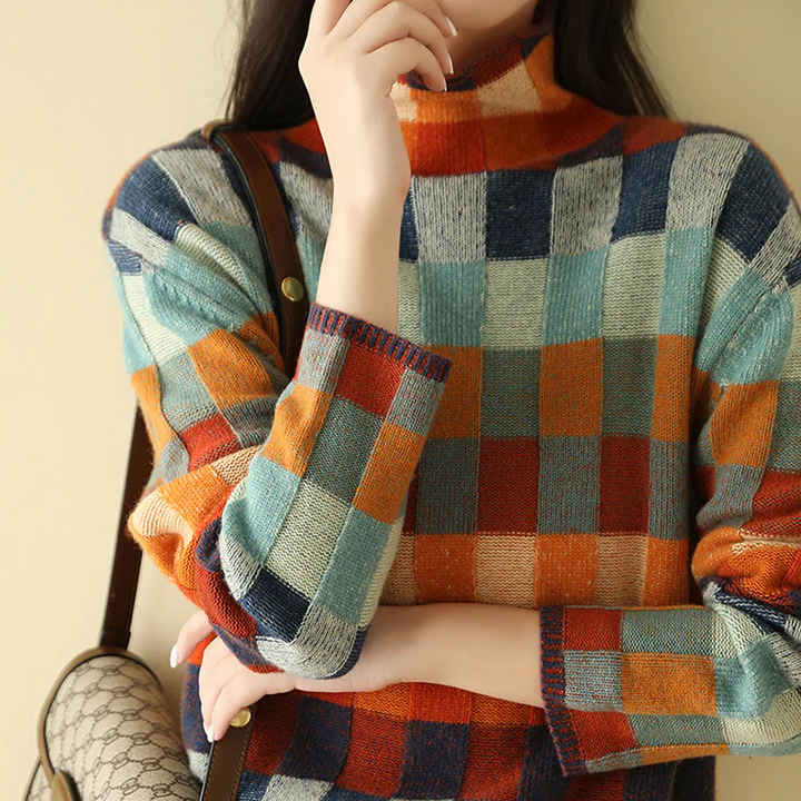 "Pull oversize en cachemire doux gris avec col roulé, idéal pour un style confortable et élégant."