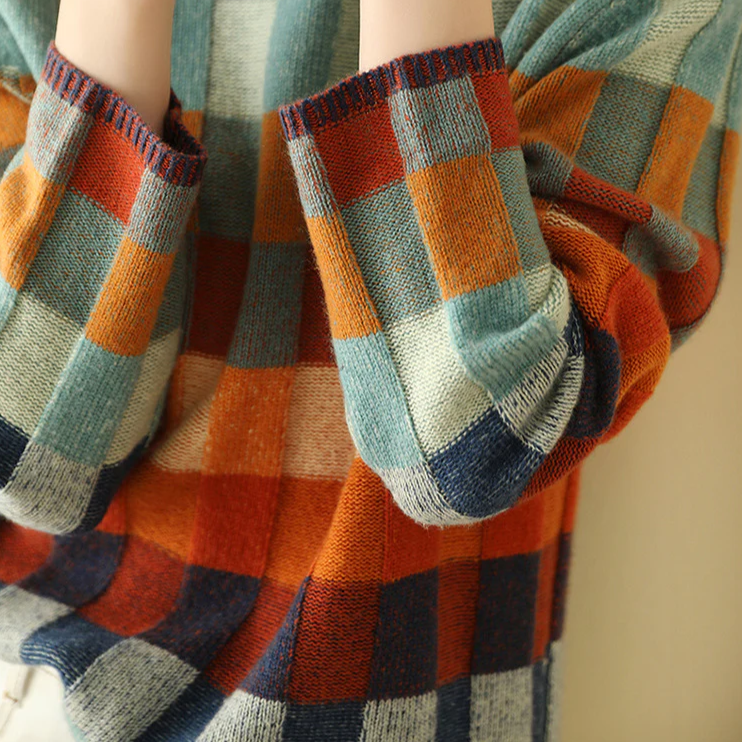 "Pull oversize en cachemire doux gris avec col roulé, idéal pour un style confortable et élégant."