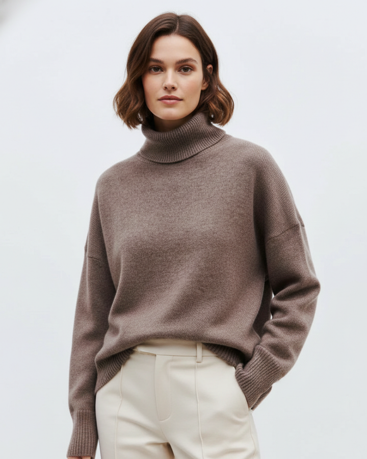Pull chaud femme Clara en tricot oversize, style vintage élégant. Idéal pour un look mode automne-hiver et un confort optimal.