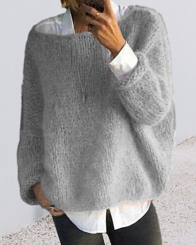 Mode femme : pull tricoté vert, coupe épaules dénudées, confort et style chic.
