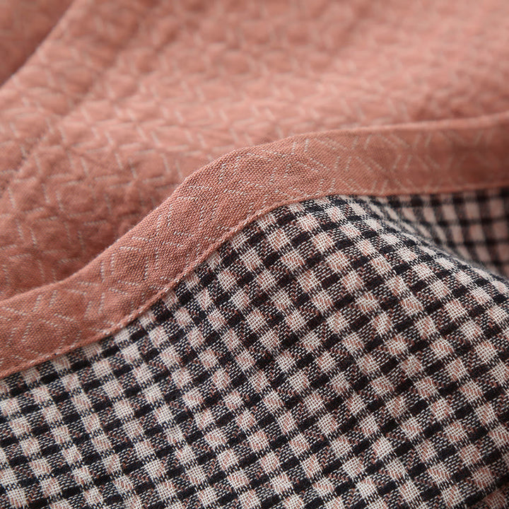 Vêtements détente : pyjama femme rose en gaze de coton ultra-doux, idéal pour la maison et le confort.