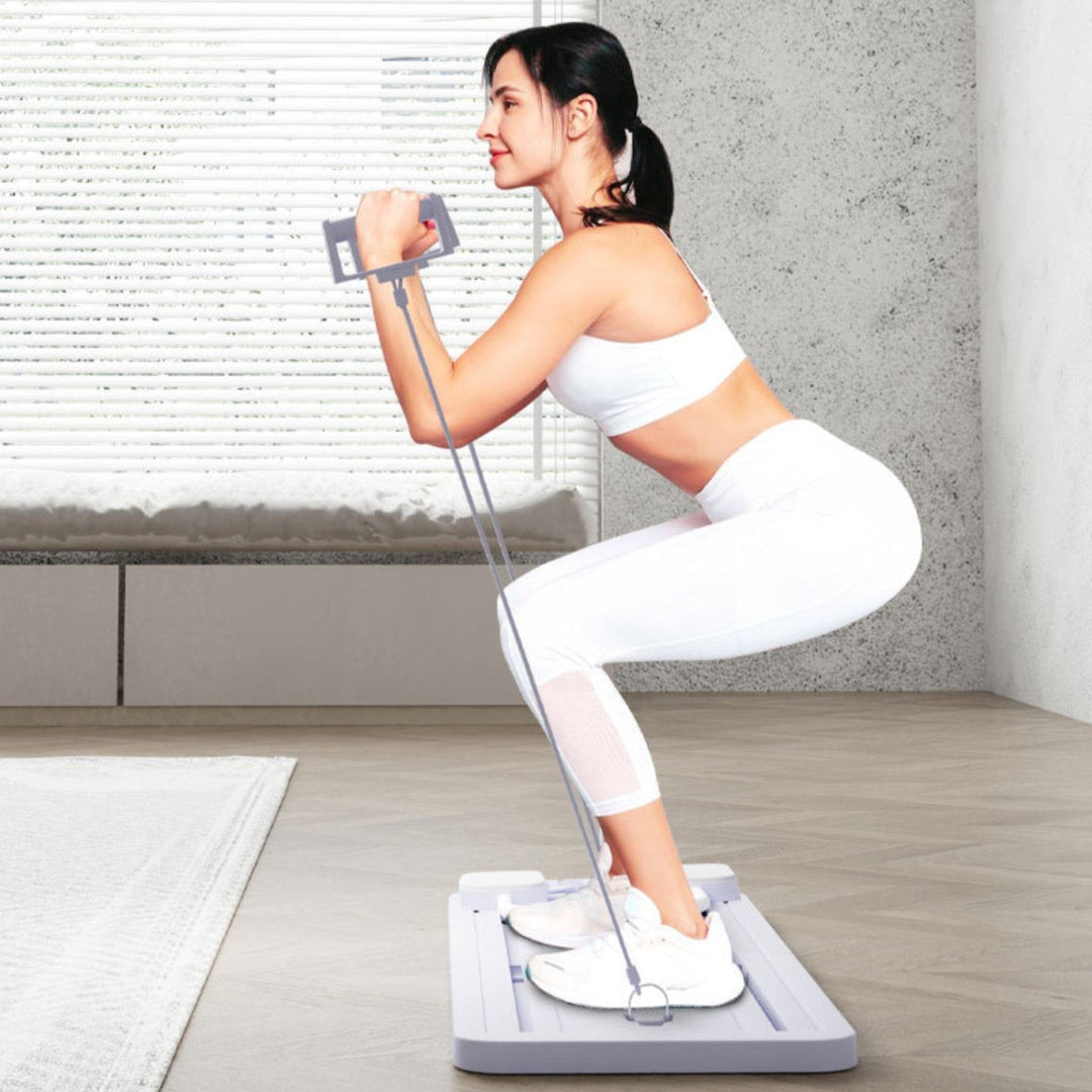 Réformateur Pilates compact noir pour maison, tonification et souplesse, élastiques résistants, usage débutant à avancé.