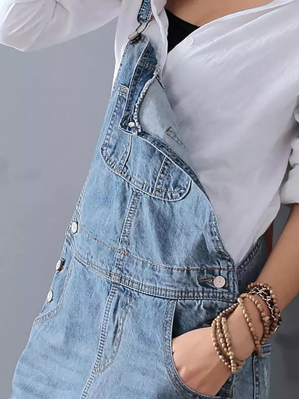 Robe salopette en jean déchiré femme, sans manches, esprit vintage, idéal pour un style décontracté.