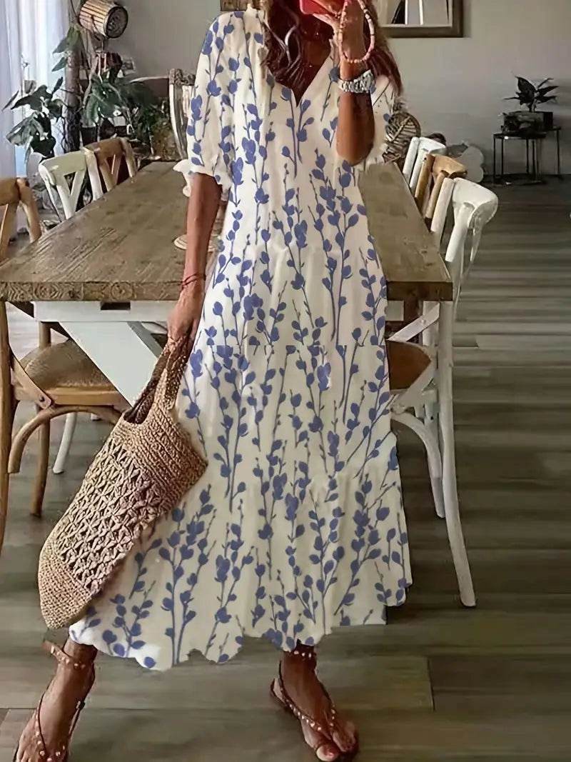 Robe bohème femme fluide à volants, col V et imprimé ikat. Parfaite pour l'été chic ou la plage.