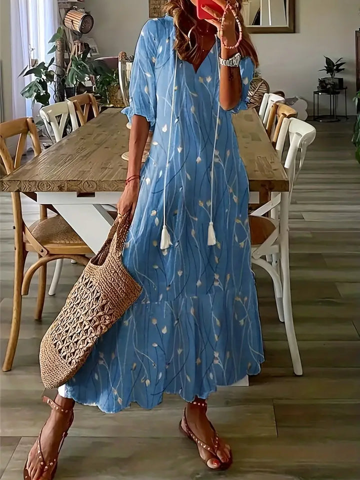 Robe fluide d'été femme bohème à volants, col V et imprimé ikat. Confortable et élégante pour la mode femme.