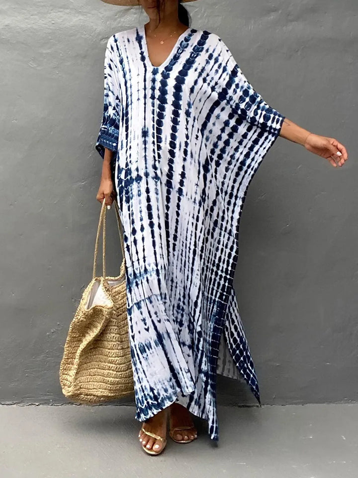 Élégante robe caftan femme, coupe fluide bohème, idéale pour les vacances d'été.