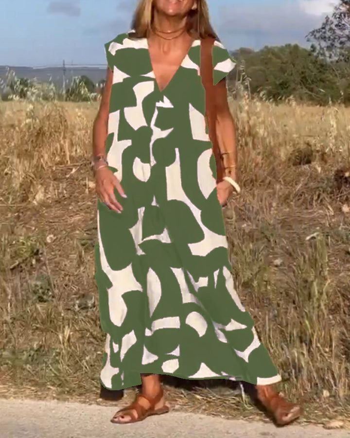 "Robe Camille élégante à imprimé moderne avec col en V flatteur, parfaite pour toutes occasions et toutes saisons."