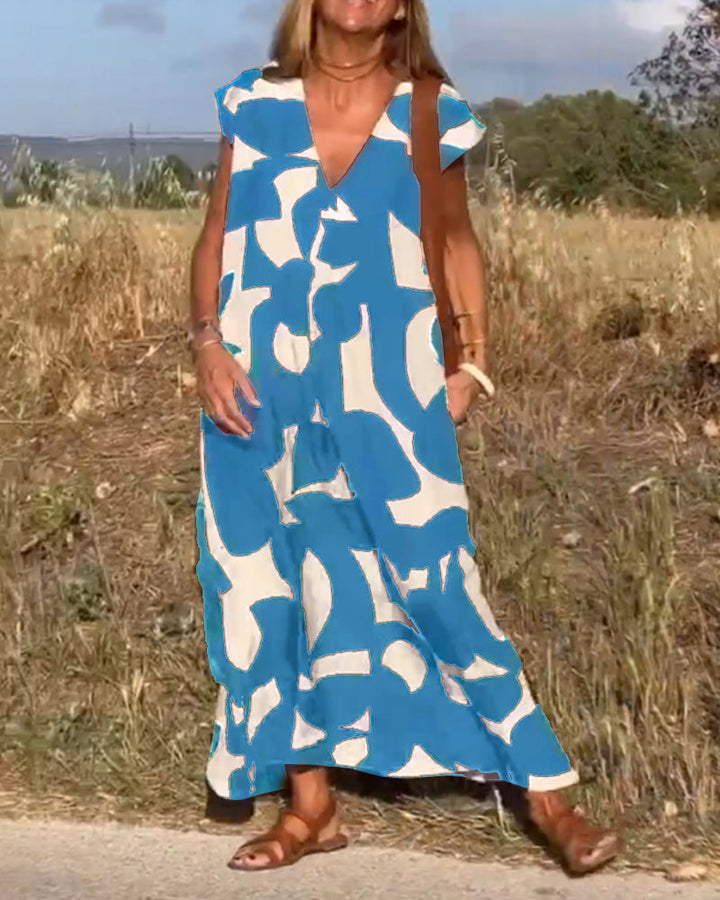 "Robe Camille élégante à imprimé moderne avec col en V flatteur, parfaite pour toutes occasions et toutes saisons."