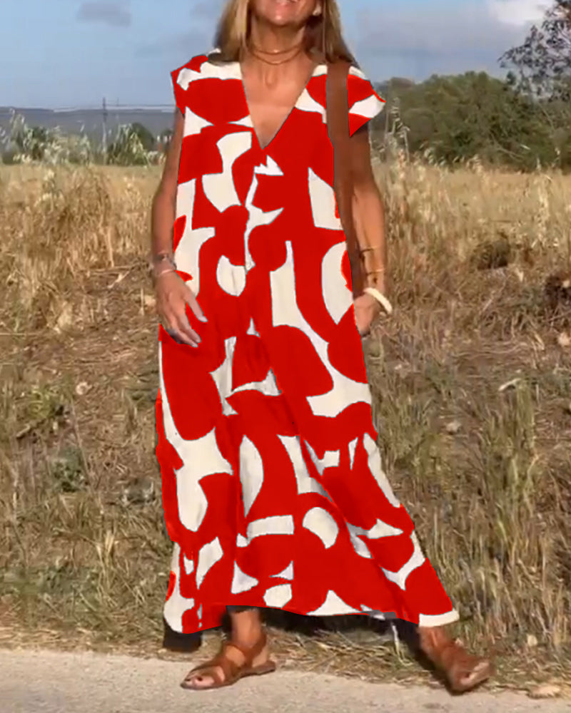 "Robe Camille élégante à imprimé moderne avec col en V flatteur, parfaite pour toutes occasions et toutes saisons."