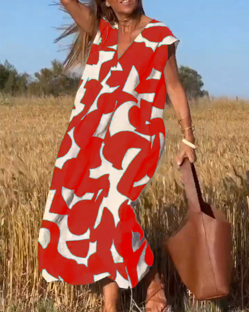 "Robe Camille élégante à imprimé moderne avec col en V flatteur, parfaite pour toutes occasions et toutes saisons."