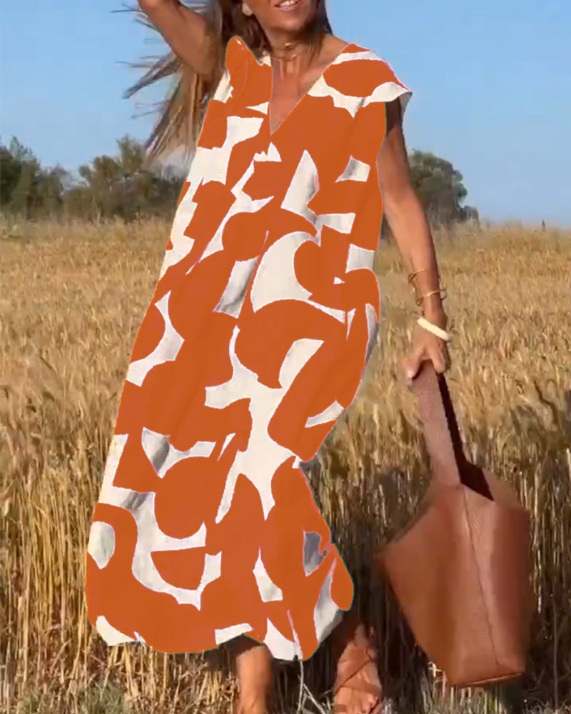 "Robe Camille élégante à imprimé moderne avec col en V flatteur, parfaite pour toutes occasions et toutes saisons."