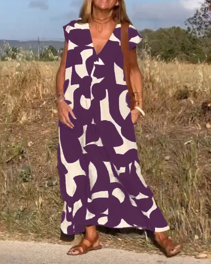 "Robe Camille élégante à imprimé moderne avec col en V flatteur, parfaite pour toutes occasions et toutes saisons."