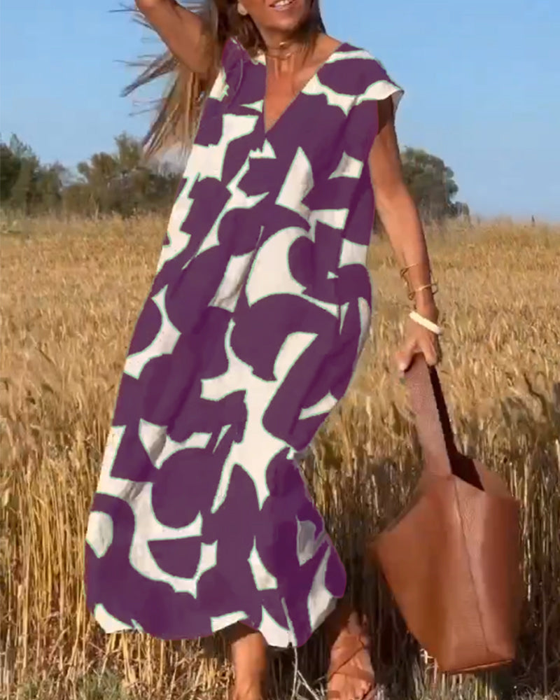 "Robe Camille élégante à imprimé moderne avec col en V flatteur, parfaite pour toutes occasions et toutes saisons."