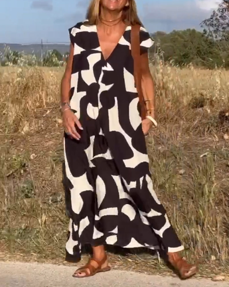 "Robe Camille élégante à imprimé moderne avec col en V flatteur, parfaite pour toutes occasions et toutes saisons."