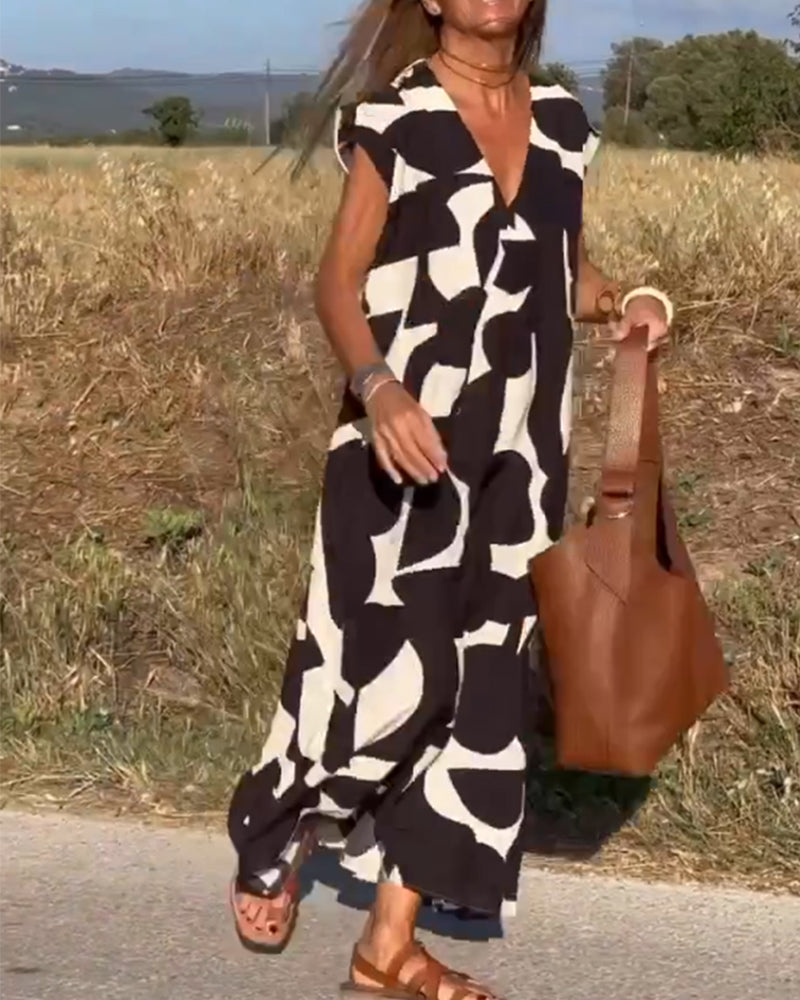 "Robe Camille élégante à imprimé moderne avec col en V flatteur, parfaite pour toutes occasions et toutes saisons."