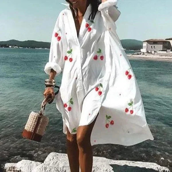 Robe chemise blanche estivale, coupe fluide et élégante.  Parfait pour l'été.