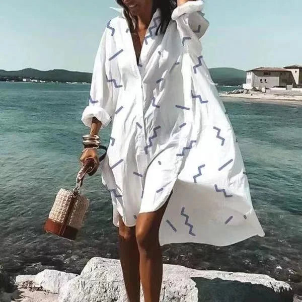 Robe chemise fluide blanche pour femme, style midi, parfaite pour l'été décontracté et chic.