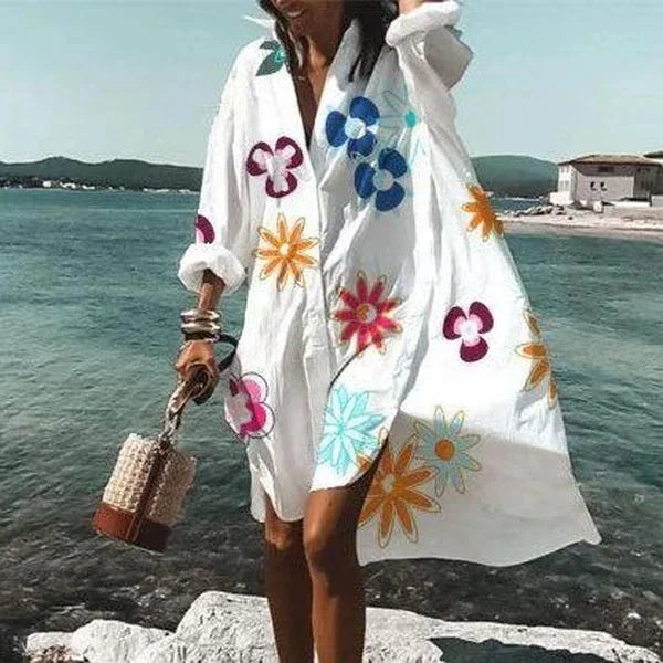Robe femme blanche fluide type chemise, style midi, confortable et élégante pour la mode estivale.
