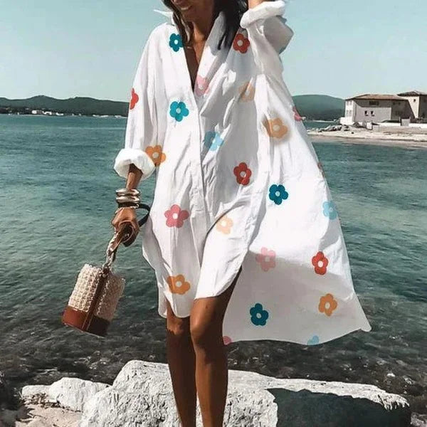 Robe fluide blanche pour femme, style chemise midi, élégante et versatile pour toutes occasions estivales.