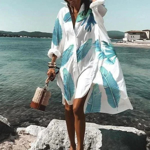 Chic robe d'été blanche, coupe chemise fluide, longueur midi, un incontournable de la garde-robe féminine.