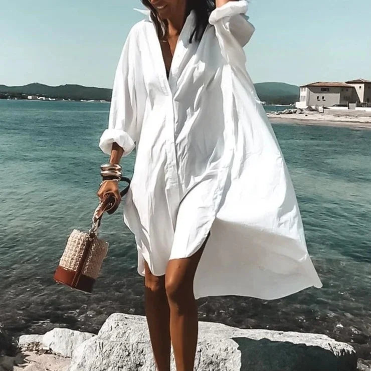 Robe chemise blanche midi fluide, parfaite pour un look estival élégant, confortable et tendance.