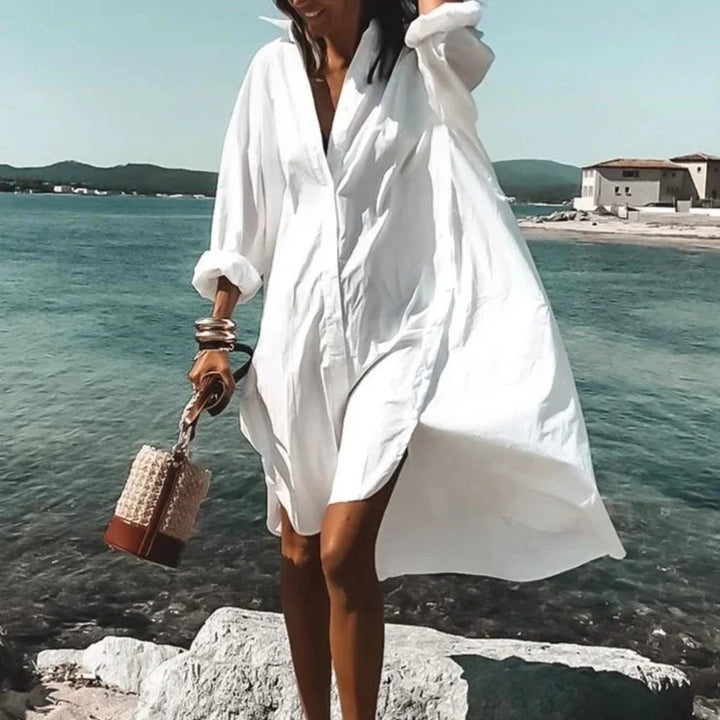 Robe chemise blanche midi fluide, parfaite pour un look estival élégant, confortable et tendance.