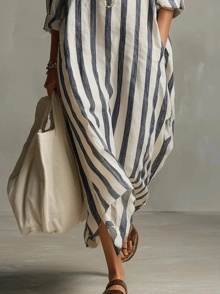 Mode féminine: robe longue rayée, coupe ample chic, idéale pour un look décontracté printemps-été.